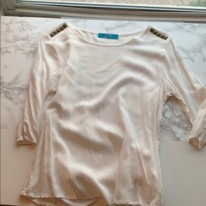 White knit blouse with gold detail shoulders